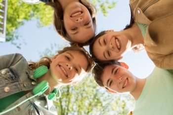 friendship and people concept - group of happy teenage friends outdoors. group of happy teenage friends