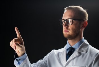 healthcare, people, profession and medicine concept - close up of male doctor in white coat touching something imaginary over black background