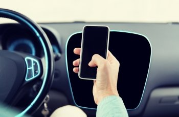 transport, business trip, technology and people concept - close up of male hand with smartphone driving car
