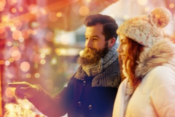 holidays, winter, christmas and people concept - happy couple in warm clothes outdoors