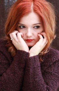 Portrait of a pretty teenage girl with redhair