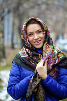 Russian beauty woman in the national patterned shawl