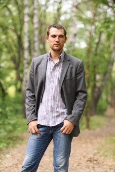 Portrait of young attractive man, outdoors