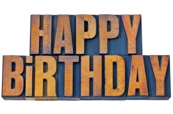 happy birthday greetings - isolated words in vintage letterpress wood type printing blocks stained by color inks