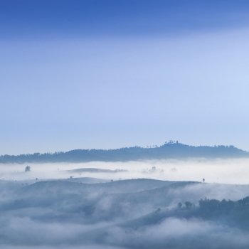 Fog covered mountains and forest in the morning. Northern Thailand is cold and cool in the morning.