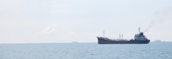 Large cargo ship. Large ship moored in the sea.
