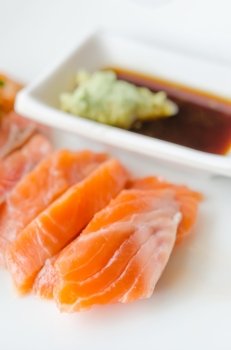 close up salmon sashimi  with wasabi sauce , japanese style cuisine