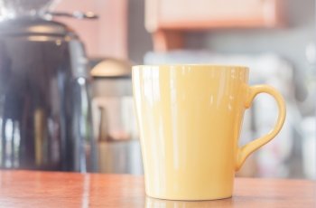 Coffee mug in coffee shop, stock photo