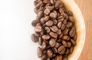 Roasted coffee bean in bowl, stock photo