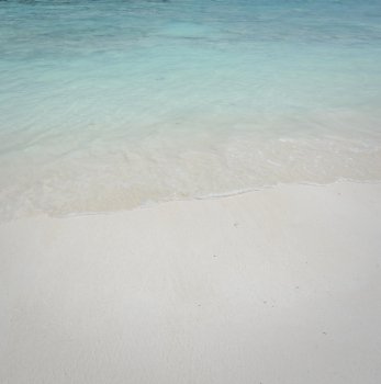 Beautiful white sand beach and crystal clear water for nature background