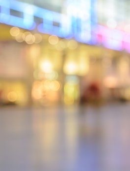 Blurred image of shopping mall with shining lights at night