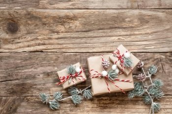 christmas gifts and decorations on wooden background