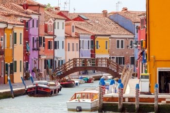 Burano, Italy - May 21 2015: The island in the lagoon near Venice. Famous tourist attraction. Famous for its colorful houses and lace.