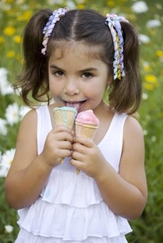 Girl with two portion of ice cream with satisfied little face