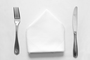 knife, fork and napkin in restaurant