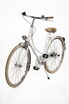 Woman’s classic bicycle on an isolated white studio background