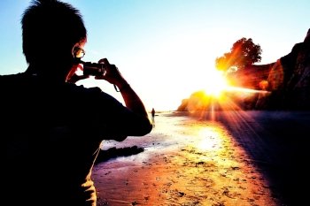 taking picture of the beach sunset in summer