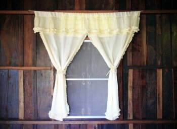 white drape and old wooden window