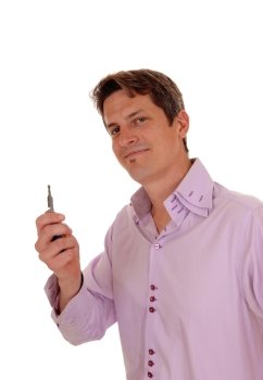 A happy handsome man holding the key of his new car up, smiling,isolated for white background.