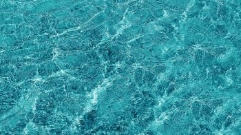 Background of transparent blue sea water
