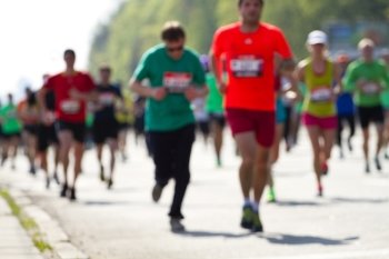 Blurred mass of marathon runners

