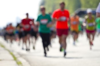Blurred mass people of marathon runners