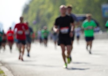Blurred mass people of marathon runners
