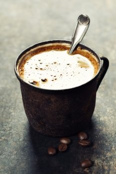 Old coffee cup on dark rustic  background
