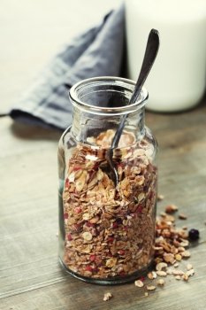 Close up of jar with granola or muesli on table - Healthy eating, Detox or Diet concept