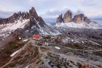 Panorama of Tre Cime and Monte Paterno at cloudy morning, Italian Dolomites