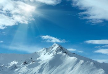 Morning winter Silvretta Alps landscape with sunshine in blue sky