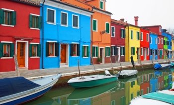 Colourful houses, adjacent to a canal, on the island of Burano, Italy