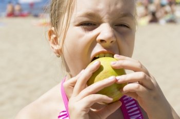 Photo of cute girl biting an apple