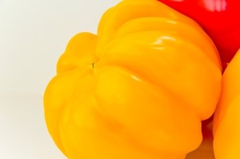 Photo of yellow raw pepper on white background