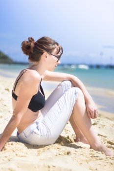 Resting Beach Babe Woman Sitting On A Beach Shoreline Near The Ocean Edge