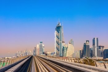 Dubai&#39;s Metro with skyscrapers  is leaving the metro station