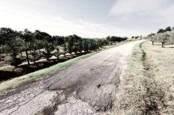 Old Broken Asphalt Road in Tuscany, Italy, Vintage Style Toned Picture