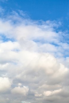 natural background - low dense white autumn clouds in blue sky