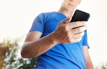 Close up of a man using mobile smart phone 