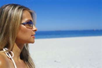 Side profile of a young woman on the beach