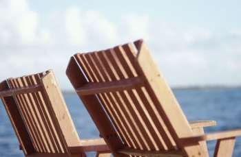 Wooden Chairs by the Ocean