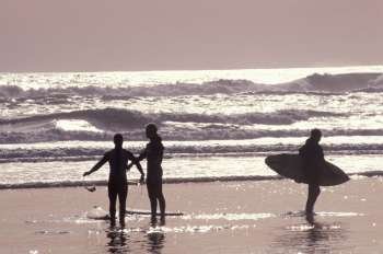Surfers Standing on the Beach