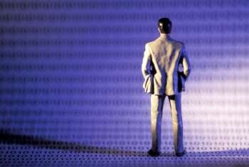 Miniature Man Standing on Digital Information
