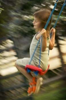 Caucasian Girl On A Swing