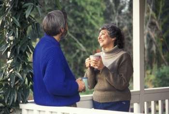 Older Couple Drinking Coffee On the Porch