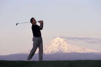 Man Golfing by Mount Hood