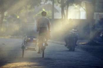 Boy Riding Bike with Sidecar