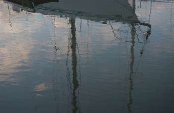 Reflection of a Boat docked at a harbor in Gimli, Manitoba, Canada