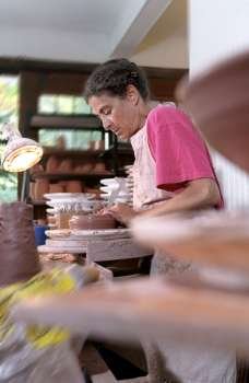 Woman Working In A Pottery Studio