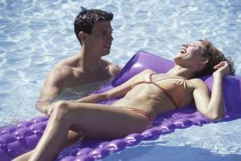 Young couple together in a swimming pool